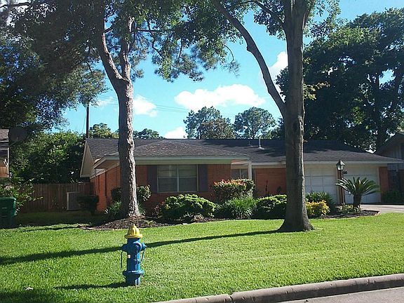 Good curb appeal with tall pines ...