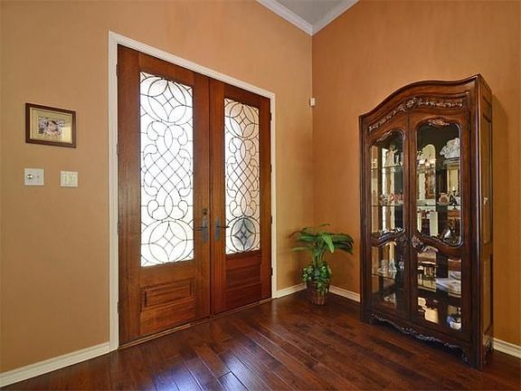 Beautiful leaded glass front doors create an elegant entry to welcome your family and friends.
