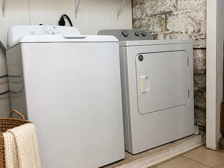 Separate laundry room and large closet space. Adjacent to additional storage space.