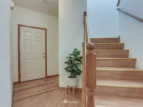 Access to the ½ bathroom, attached 2 car garage and stairs all from the entryway.