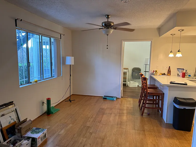 Dining area and kitchen bar and kitchen on right.