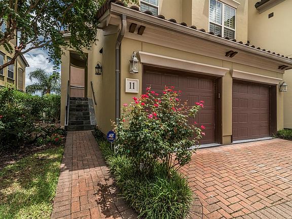 Mediterranean design features tile roof and stucco exterior.