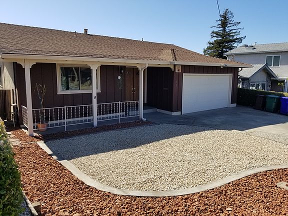 front of house with stone covering throughout.