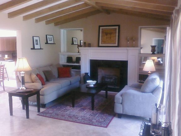 vaulted ceiling, travertine marble floors, gas firelplace