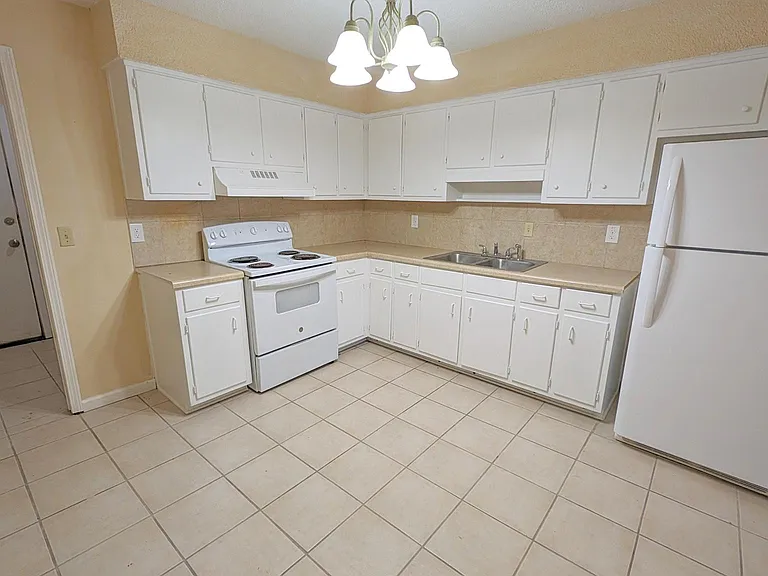 Spacious kitchen with lots of storage. Attached mudroom with backyard access