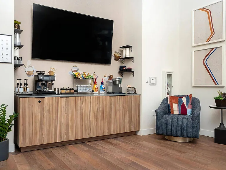 Resident Lounge Featuring Coffee Bar with Snacks and Espresso Machine