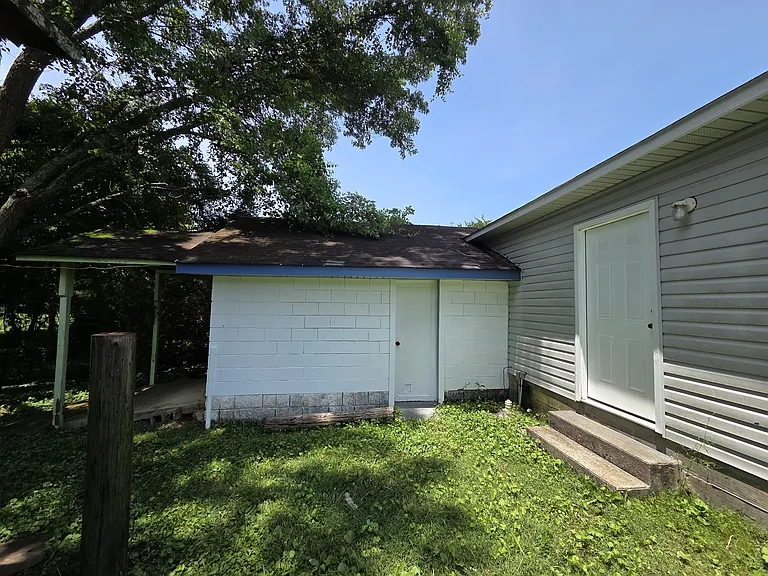 Storage room next to two car garage