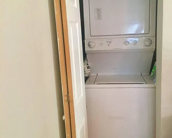 laundry nook located in living room