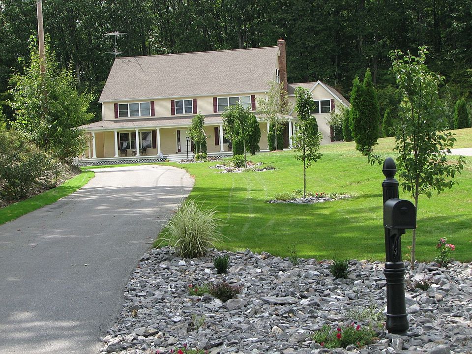 Beautiful Colonial with Full Wrap-Around Front Porch with Decortative Columns
