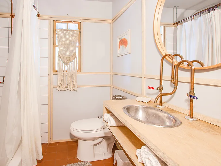 Guest bathroom with copper hardware