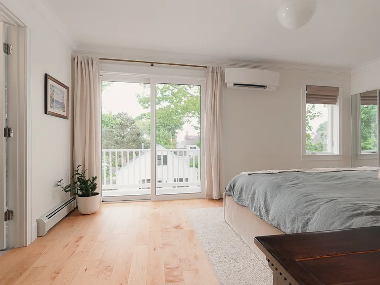 Primary Bedroom w/ balcony sliding door