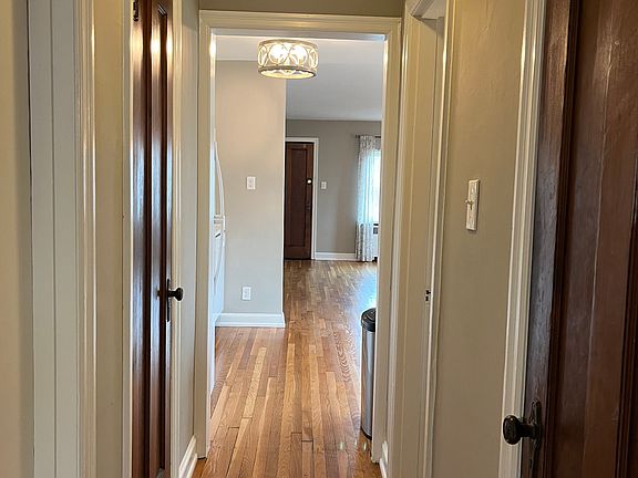 Looking out from the bedroom toward the front of the apartment. Hall closet on the right, Pantry on the left.