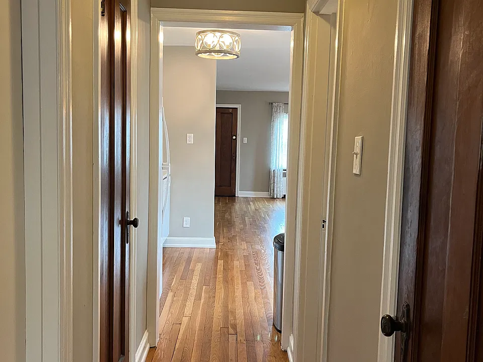 Looking out from the bedroom toward the front of the apartment. Hall closet on the right, Pantry on the left.