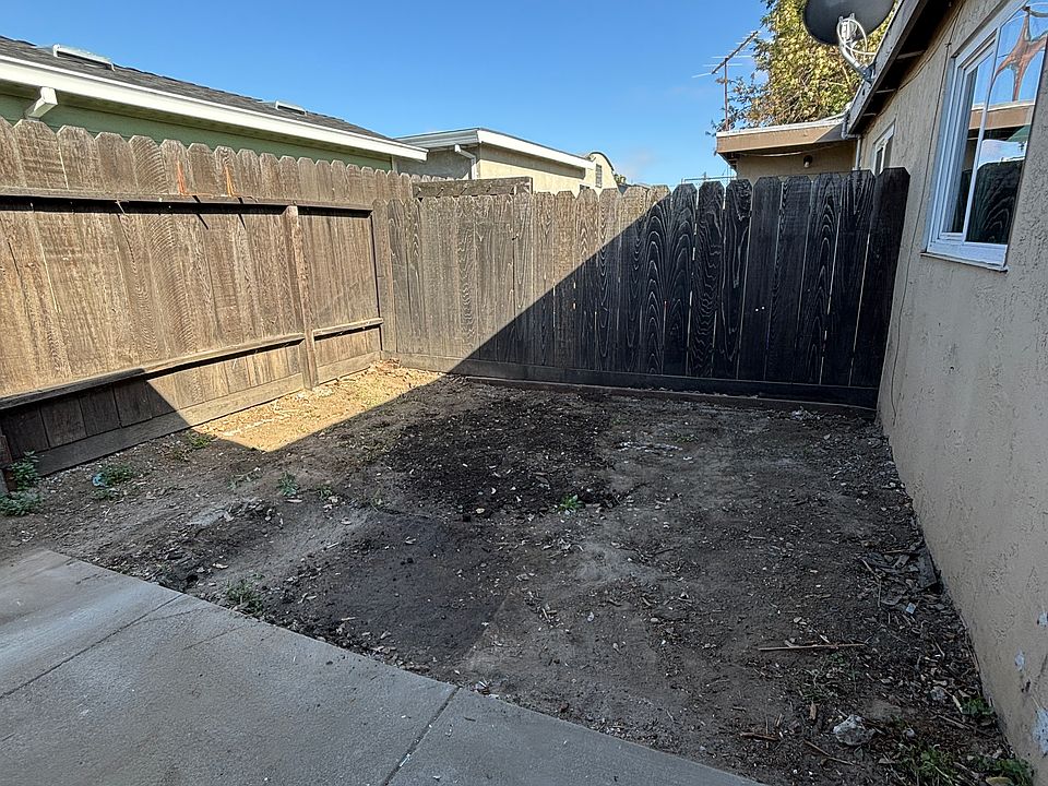 Backyard with concrete patio area