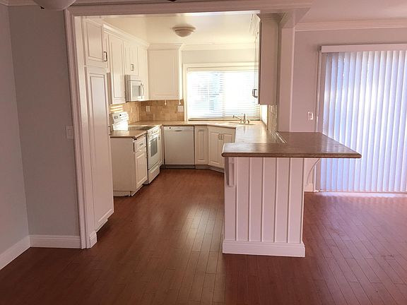 Kitchen opens to dining room