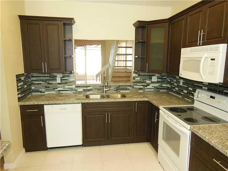 Updated kitchen with granite counter tops, new cabinets, smo