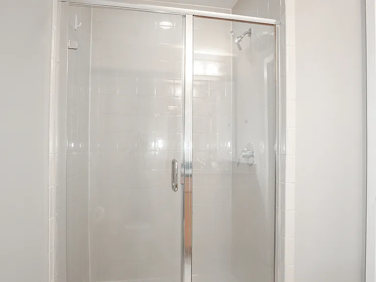 Glass-Enclosed Shower with Contemporary Tile Finish
