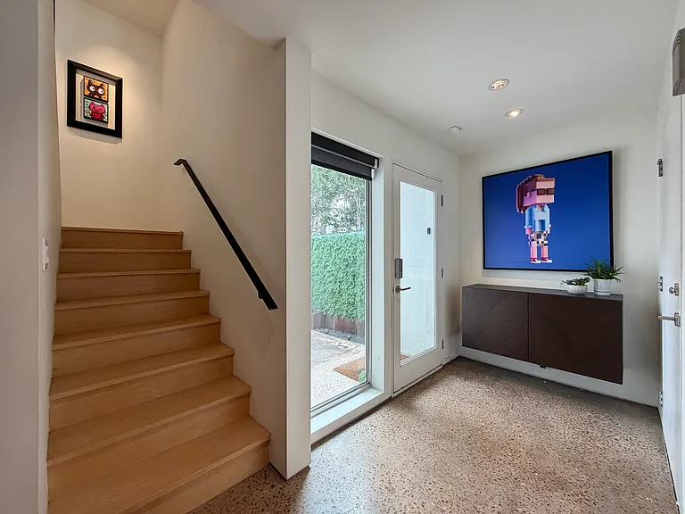 Entry leads into flex space that can be utilized as an office, living area, or additional bedroom.