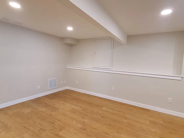 Living room; stairs in left side of photo
