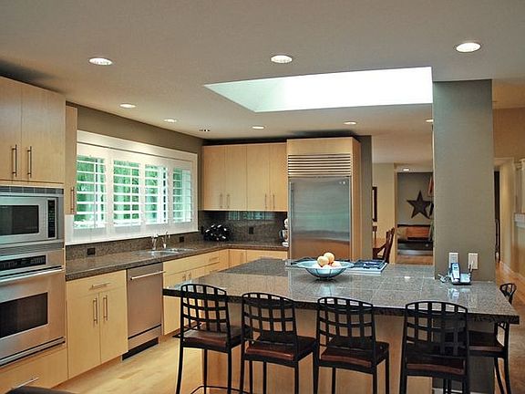 Large sunlight in kitchen brings natural light in
