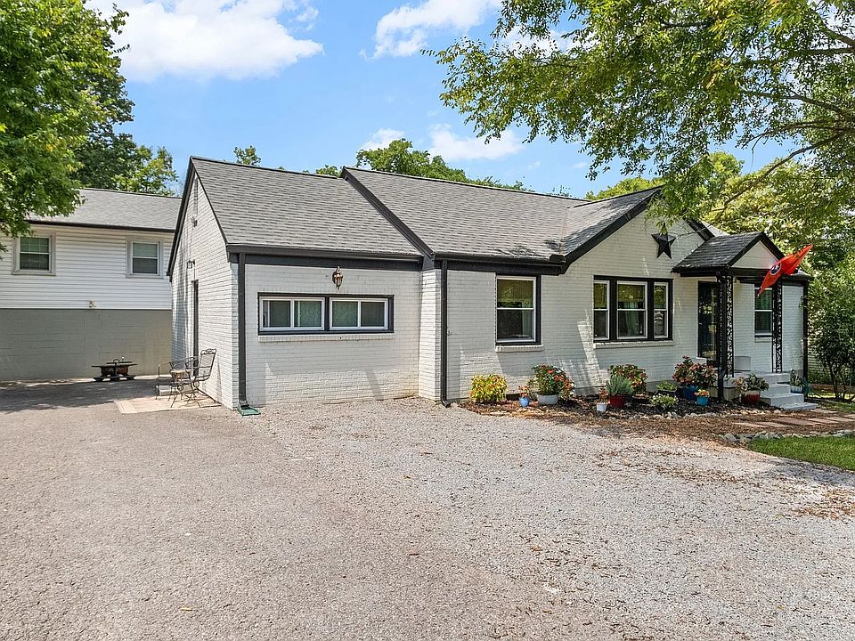 Front entrance with driveway and parking area
