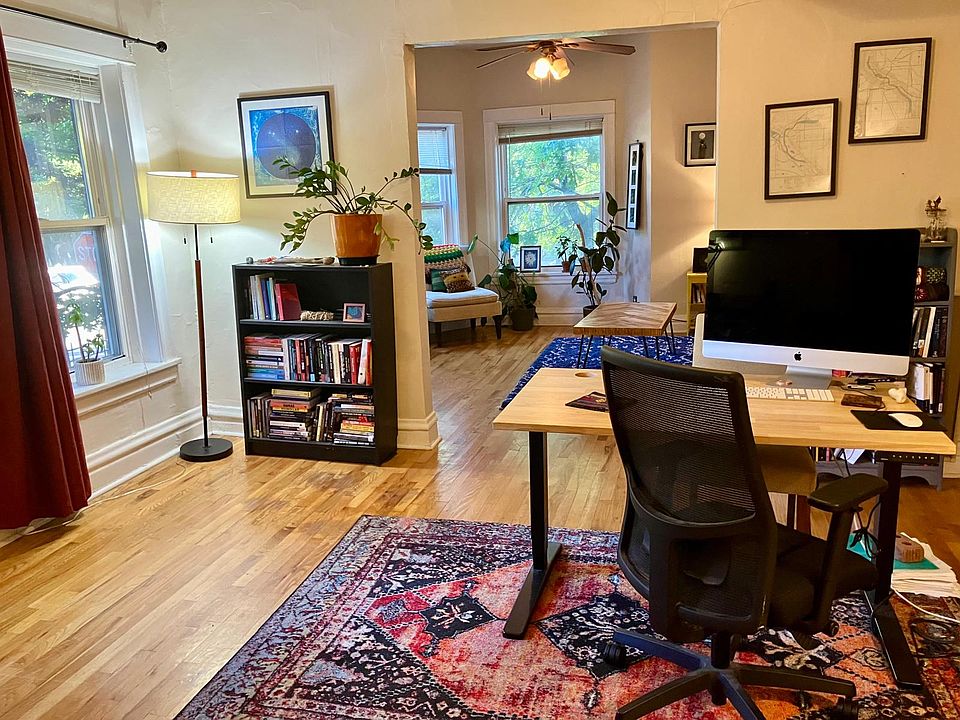 View of the apartment as you enter: entryway includes large closet (to left of picture), then step into the dining room, with the living room pictured at the end