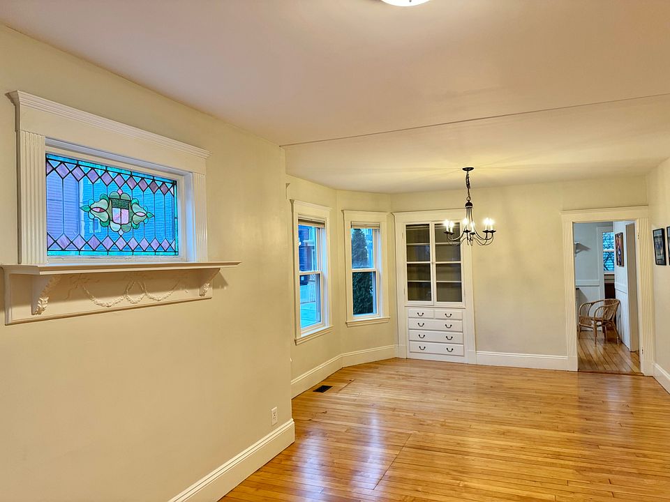 LR/DR open concept w/ original stained glass, built-in China cabinet, hardwood floors