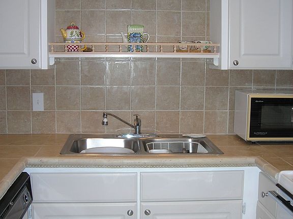 Look how cute: tiled counter top and back-splash!