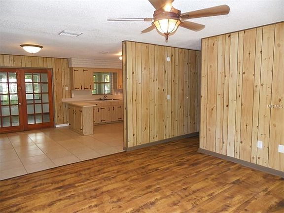 Living room flows into dining room and kitchen