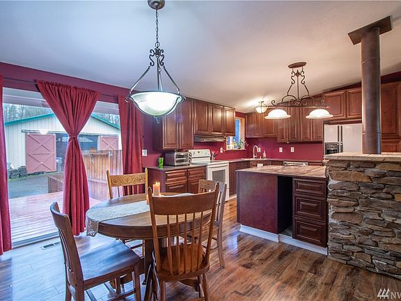 Dining area is convenient and could fit a much larger table lots of room.