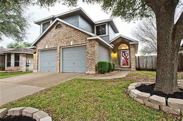 Check out the curb appeal on this charming home!Beautifully landscaped, mature trees and recent exterior paint (2015)