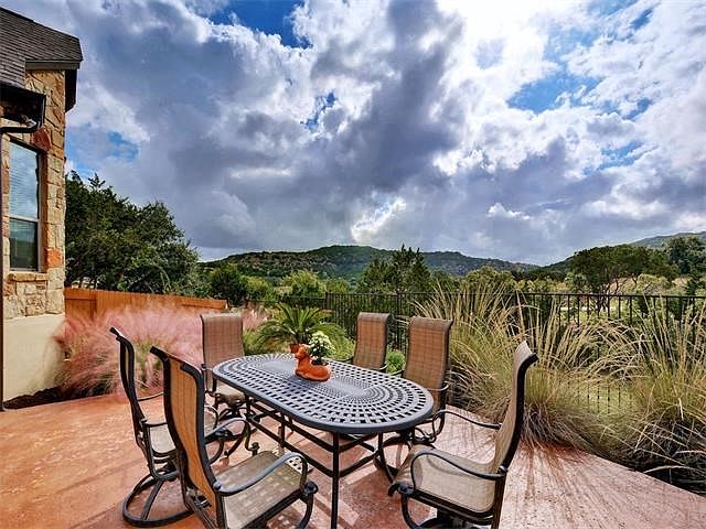 Greenbelt backyard with Hill Country views