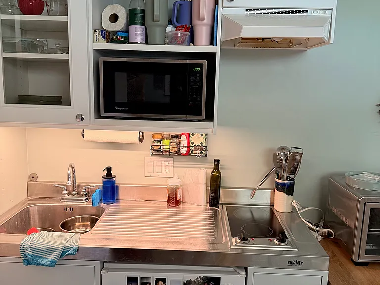 Kitchenette has 2 burners,fridge, and microwave oven.