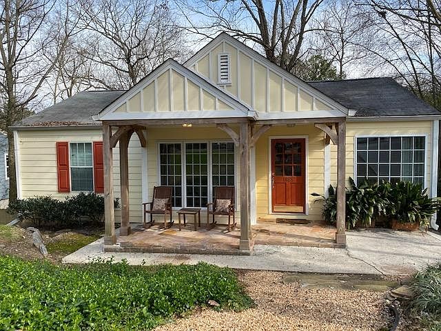 front of house with rocking chair front porch