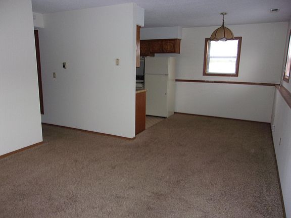 livingroom, hallway, dining area, and kitchen entrance
