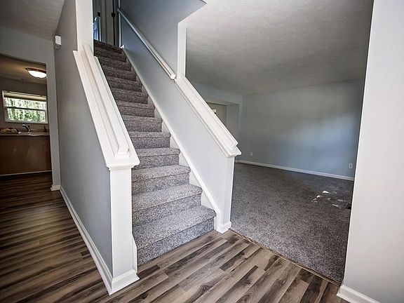 Fresh paint, brand new carpet and laminate hardwood flooring throughout