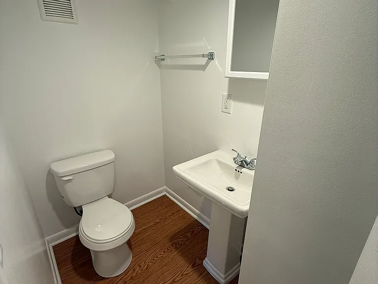 Half-bathroom attached to den.