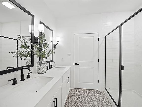 Primary bath with glass shower enclosure