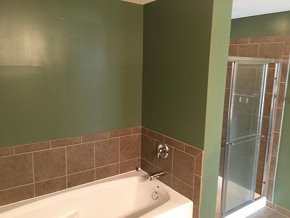 Master soaker tub and standup shower.