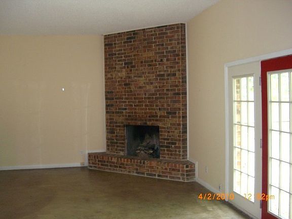 Gas fire place and back door into yard.