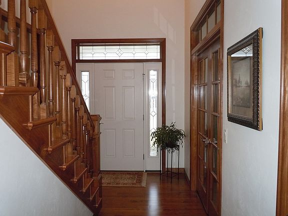 Front entryway with hardwood flooring