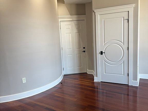 Curved art wall with highlighting lights.