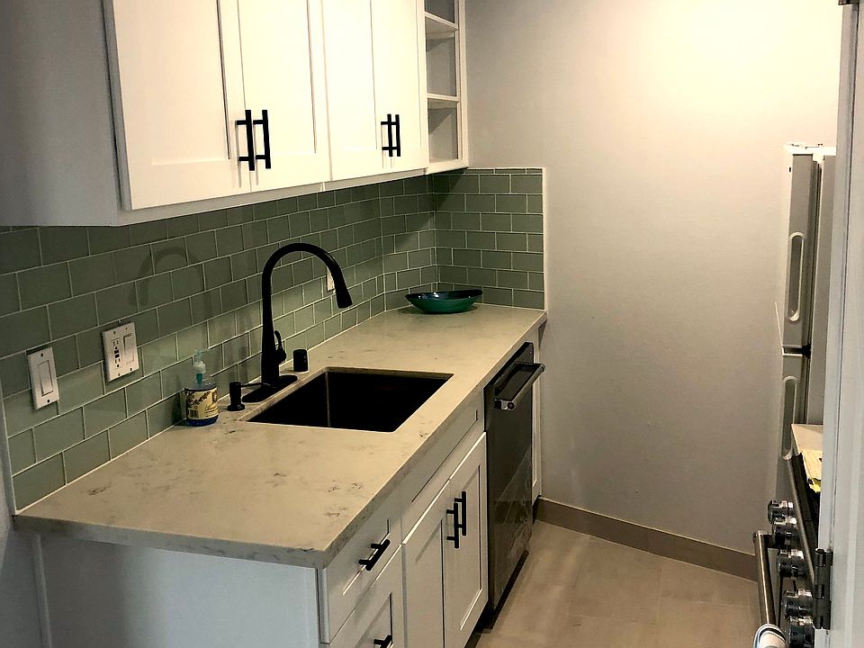 Quartz counters in kitchen and bathroom. Upgraded appliances.