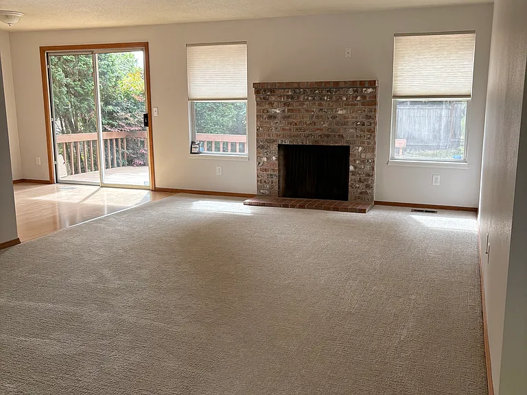 Nice open living space! Brick fireplace decorative only.