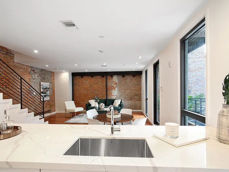 The kitchen is equipped with all of the essentials including cookwear, diningwear and silverware.