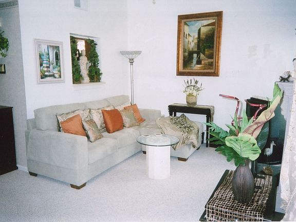 Couch faces Fireplace