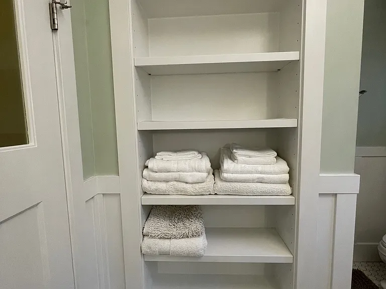 Built in for towels and toiletries.