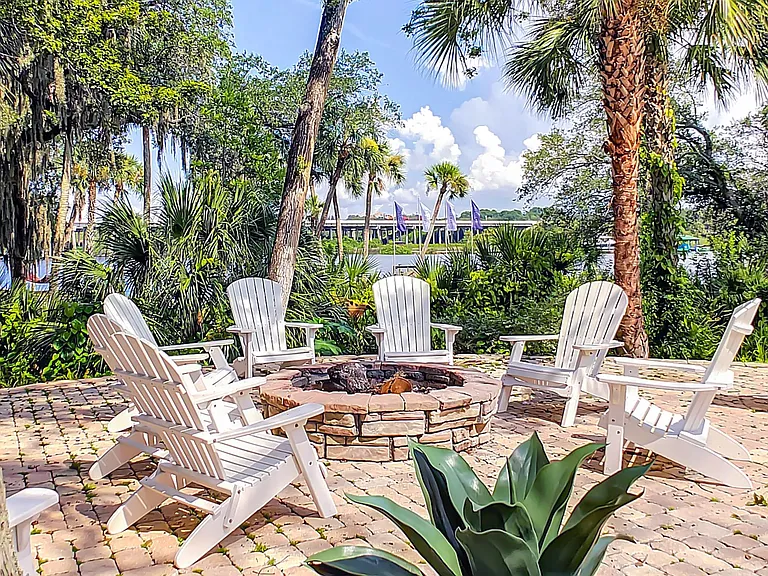 Indulge in serene evenings around a warm fire at our secluded waterfront fire pit.