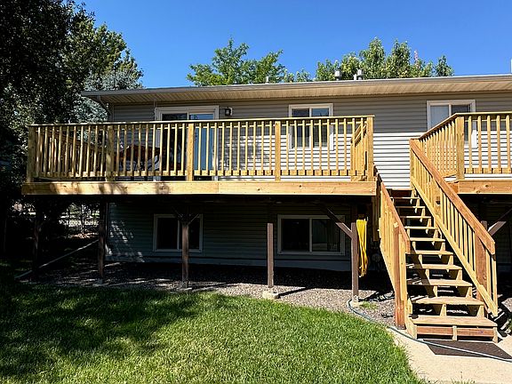 Back of property view of shared deck & yard.