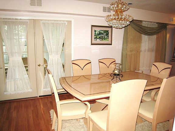 Dining Room with French doors leading to covered porch